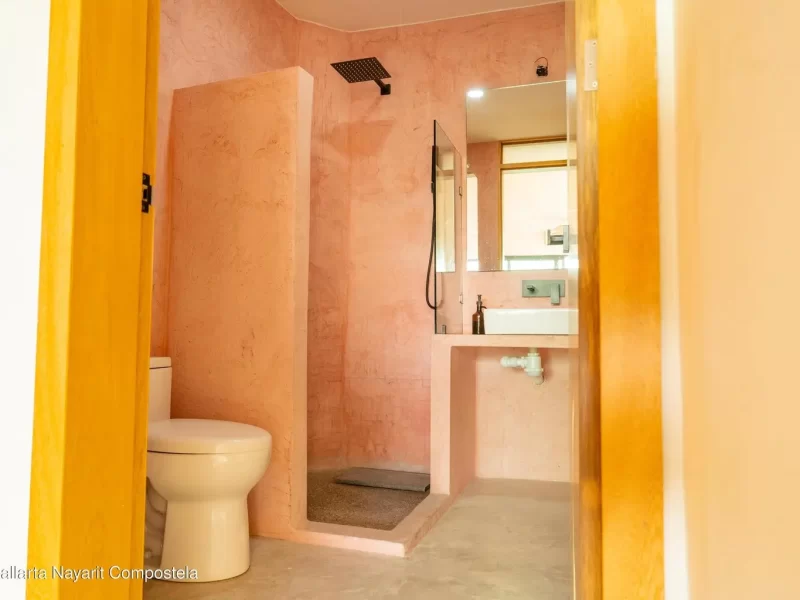 edificio-bolivia-bano-microcemento-rosa-regadera-lluvia-01